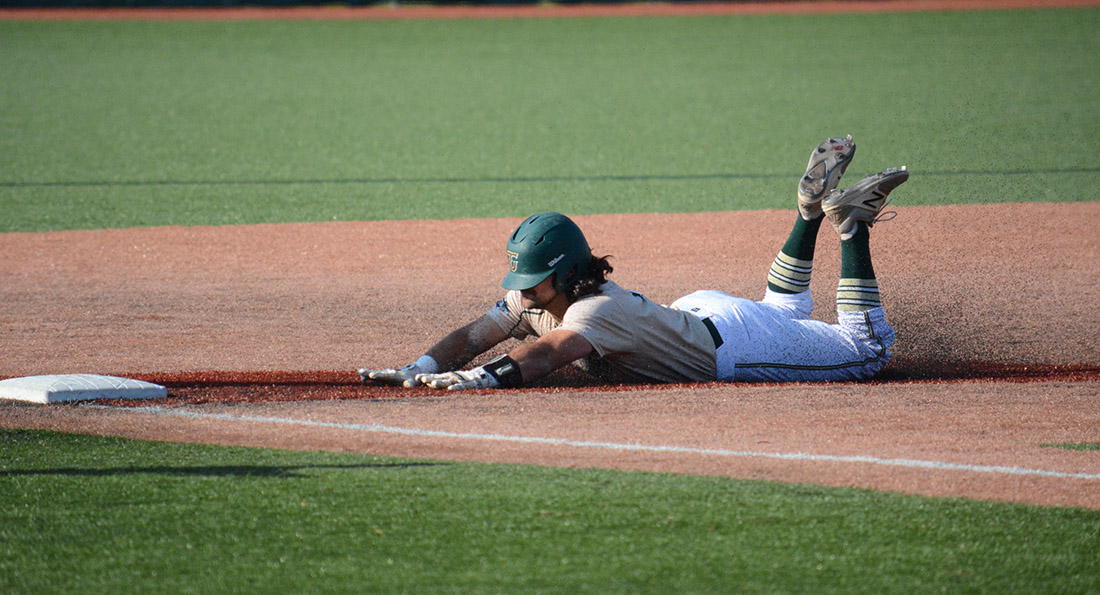 Kyle Lento slides into third base with a run scoring triple in Tiffin's 7-5 win over Grand Valley State.