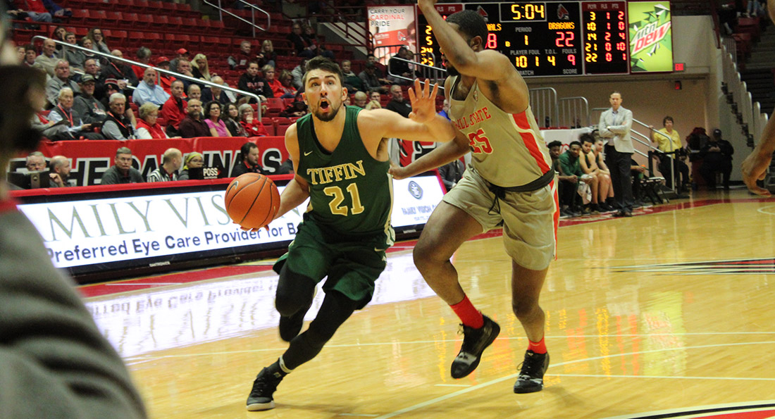 Austin Adams led the Dragons with 18 points in an exhibition loss at Ball State.